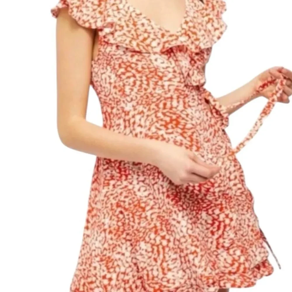 Free People French Quarter Wrap Mini Dress orange and white animal small